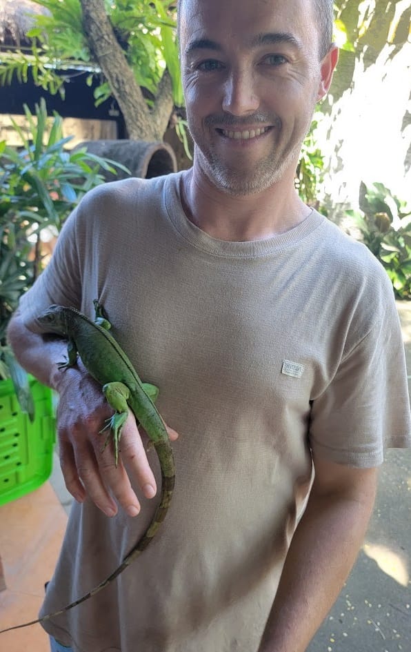 James Kenneth holding a Baby Green Iguana